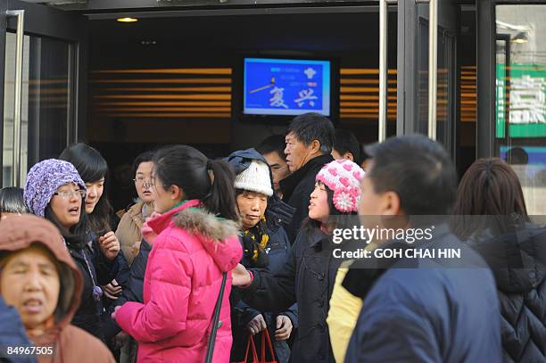 Chinese Christians make their way out of the Haidian Christian Church after the departure of US Secretary of State Hillary Clinton, who was also...