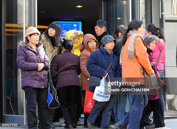 Chinese Christians make their way out of the Haidian Christian Church after the departure of US Secretary of State Hillary Clinton, who was also...