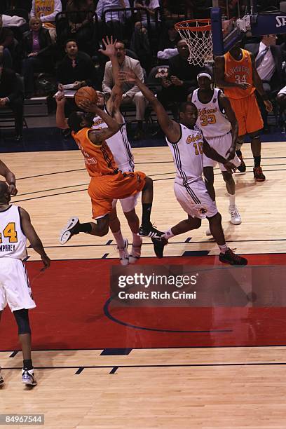 Keith McLeod of the Albuquerque Thunderbirds shoots over Keith Clark of the Tulsa 66ers in the D-League game on February 21, 2009 at the SpiritBank...