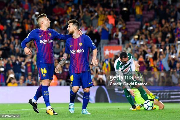 Lionel Messi of FC Barcelona celebrates with his team mate Gerard Delofeu of FC Barcelona after scoring his team's first goal from the penalty spot...