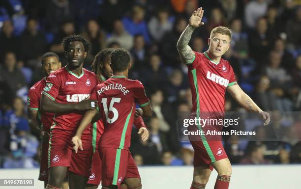 Alfie Mawson of Swansea City celebrates scoring his sides first goal of the match during the Carabao Cup Third Round match between Reading and...