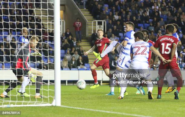 Alfie Mawson of Swansea City scores his sides first goal of the match during the Carabao Cup Third Round match between Reading and Swansea City at...