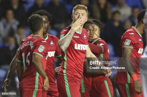 Alfie Mawson of Swansea City celebrates scoring his sides first goal of the match during the Carabao Cup Third Round match between Reading and...