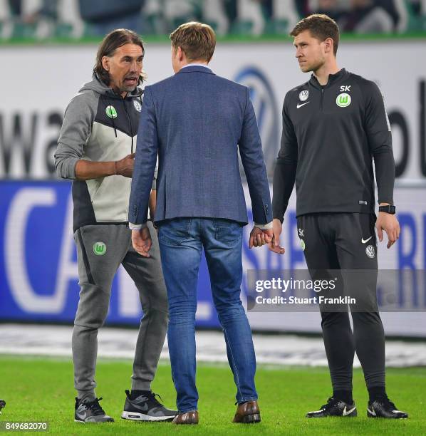 Martin Schmidt, head coach Wolfsburg talks with v, sports director of Wolfsburg after the Bundesliga match between VfL Wolfsburg and SV Werder Bremen...