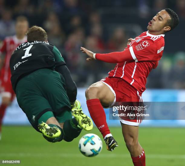 Ralf Faehrmann of Schalke fights for the ball with Thiago Alcantara of Bayern Muenchen during the Bundesliga match between FC Schalke 04 and FC...