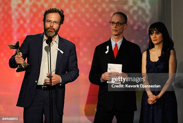 Director John Waters and actress Zooey Deschanel watch as Thomas McCarthy accepts Best Director Award for " The Visitor" during the 24th Annual Film...