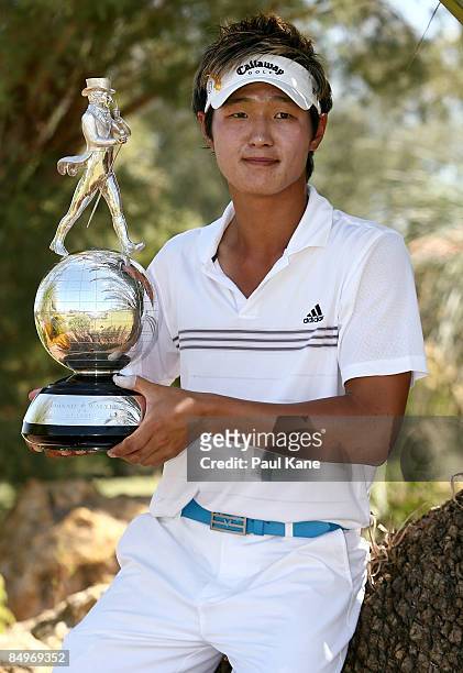 Danny Lee of New Zealand poses with the Johnnie Walker trophy after winning the 2009 Johnnie Walker Classic at The Vines Resort and Country Club on...