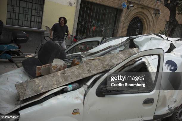 Vehicle is seen destroyed by debris from a collapsed building following an earthquake in the neighborhood of Condesa, Mexico City, Mexico, on...