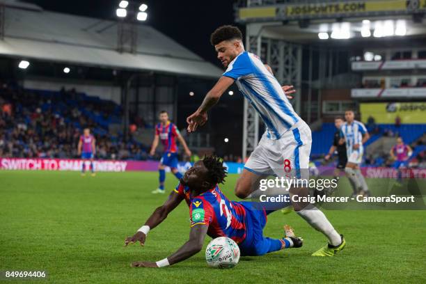 Crystal Palace's Pape N'Diaye Souare is fouled by Huddersfield Town's Philip Billing during the Carabao Cup Third Round match between Crystal Palace...