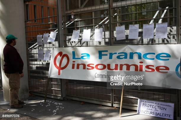 Man reads writings in support of Céline Boussié, French whistleblower and president of the association &quot;Handi'gnez-vous!&quot; which she created...