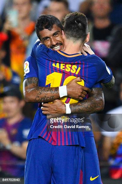 Paulinho of FC Barcelona celebrates with his team mate Lionel Messi after scoring his team's second goal during the La Liga match between Barcelona...