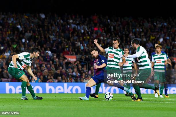 Lionel Messi of FC Barcelona scores his team's fourth goal during the La Liga match between Barcelona and SD Eibar at Camp Nou on September 19, 2017...