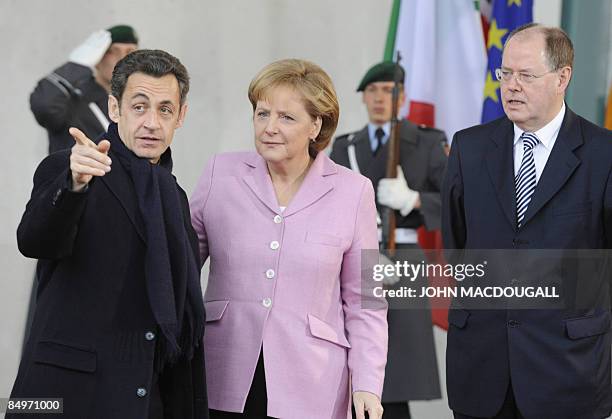 German Chancellor Angela Merkel and German Finance Minister Peer Steinbrueck greet French President Nicolas Sarkozy prior to a G20 preparatory...