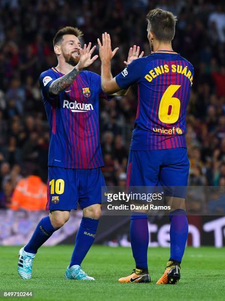 Denis Suarez of FC Barcelona celebrates with bis team mate Lionel Messi of FC Barcelona after scoring his team's third goal during the La Liga match...