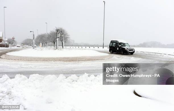 Car struggles in the cold conditions in Wallsend near Newcastle as snow and sleet hit parts of north England today as freezing winds sweep across...