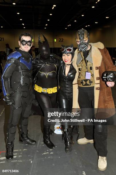 Scott as Knight Wing, Pheobe as Batgirl, Jojo as Cat Woman, and Anthony as Bane all in costume for the annual London Super Comic Convention, held at...
