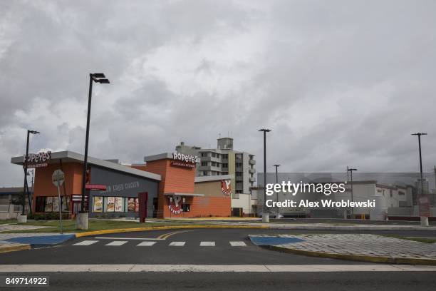 Empty businesses stand along Avenida Munoz Rivera as residents prepare for a direct hit from Hurricane Maria on September 19, 2017 in San Juan,...