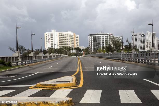 Empty businesses stand along Avenida Munoz Rivera as residents prepare for a direct hit from Hurricane Maria on September 19, 2017 in San Juan,...