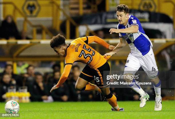 Tom Lockyer of Bristol Rovers pulls back Donovan Wilson of Wolverhampton Wanderers and is sent off during the Carabao Cup tie between Wolverhampton...