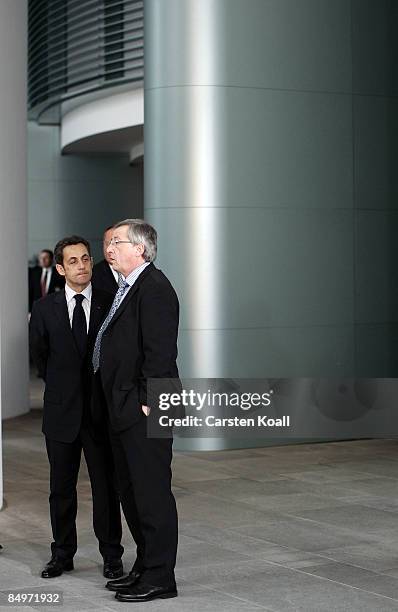 French President Nicolas Sarkozy and Luxembourg's Prime Minister and President of the Eurogroup Council Jean-Claude Junker talk after a meeting of...