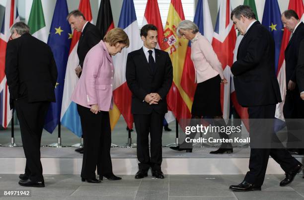 German Chancellor Angela Merkel , French President Nicolas Sarkozy , and British Prime Minister Gordon Brown come together for a family photo after a...