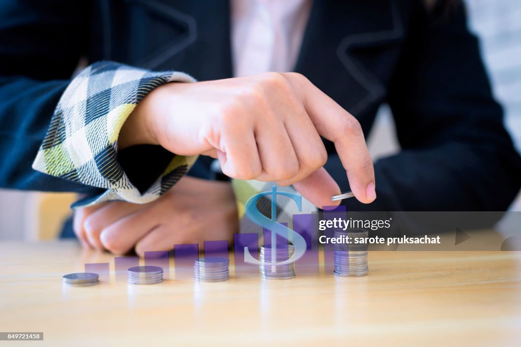 Women putting coins on stack with holding money, Concept business, finance, money saving