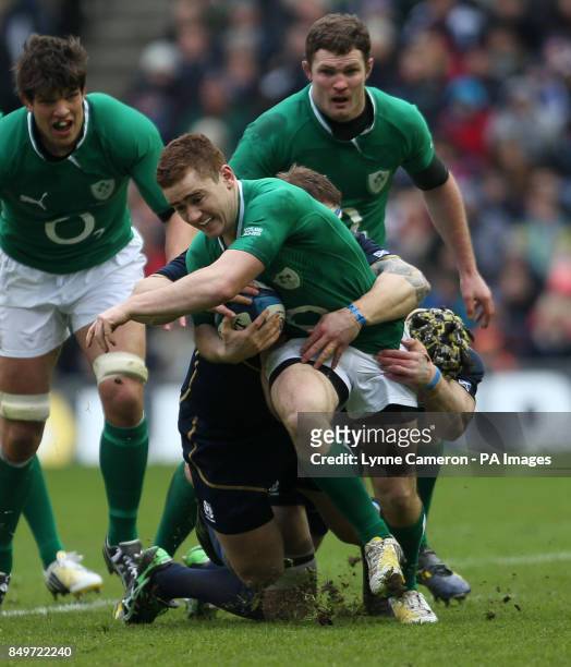 Ireland's Paddy Jackson is tackled by Scotland's Kelly Brown during the RBS 6 Nations match at Murrayfield, Edinburgh.