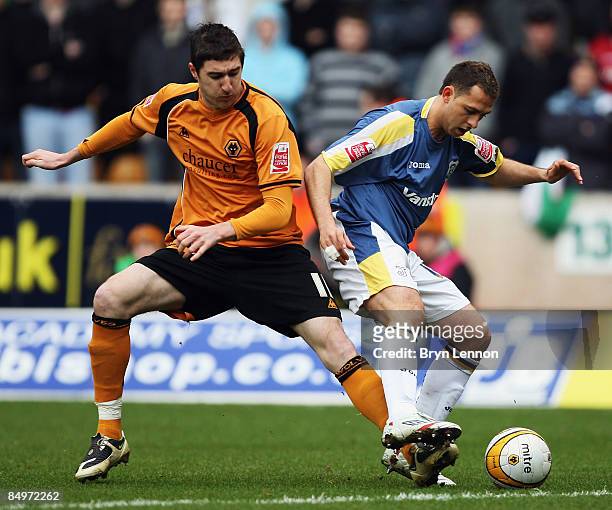 Stephen Ward of Wolverhampton Wanderers tackles Michael Chopra of Cardiff City during the Coca Cola Championship match between Wolverhampton...