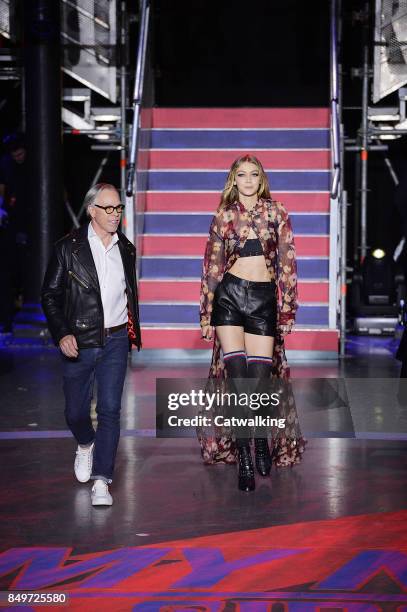 Fashion designer Tommy Hilfiger walks the runway with supermodel Gigi Hadid at the TOMMYNOW by Tommy Hilfiger Fall Winter 2017 fashion show during...