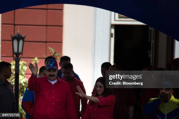 Nicolas Maduro, Venezuela's president, waves to attendees during a rally in support of Nicolas Maduro, Venezuela's president, not pictured, in...