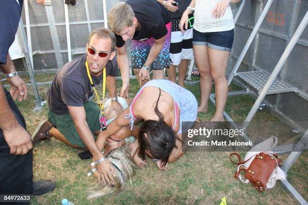 Patron faints and is helped during the Good Vibrations Festival 2009 on Harrison Island on February 22, 2009 in Perth, Australia.