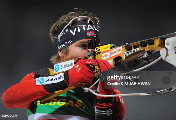 Emil Hegle Svendsen of Norway shoots during the men's relay race at the IBU World Biathlon Championships in Pyeongchang, east of Seoul on February...
