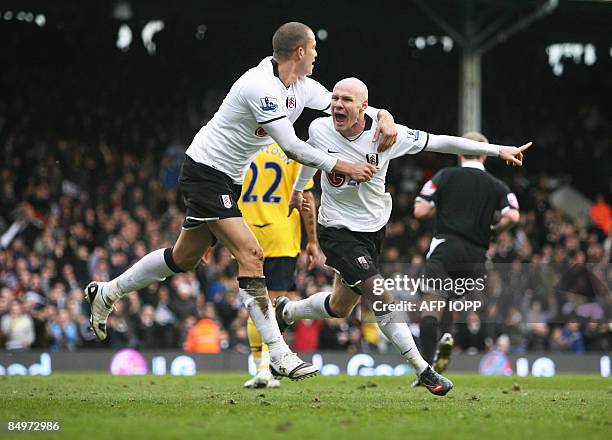 Fulham's Andy Johnson celebrates scoring the second goal with Bobby Zamora against West Bromwich Albion during their Premier League football match at...