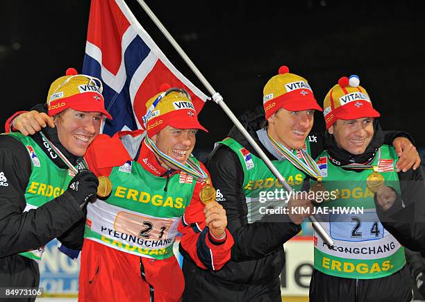 Gold medallists of Norway, Emil Hegle Svendsen, Halvard Hanevold, Lars Berger and Ole Einar Bjoerndalen pose on the podium after the men's relay race...