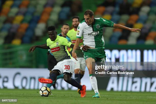Maritimo forward Piqueti from Guinea Bissau vies with Sporting CP midfielder Radosav Petrovic from Serbia for the ball possession during the match...