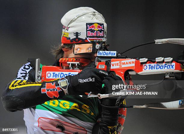 Michael Roesch of Germany shoots during the men's relay race at the IBU World Biathlon Championships in Pyeongchang, east of Seoul on February 22,...