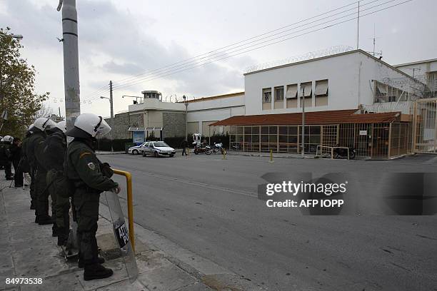 Policemen stand guard around the Korydalos prison area after serial armed robber and kidnapper Vassilis Paleocostas with his Albanian sidekick Alket...
