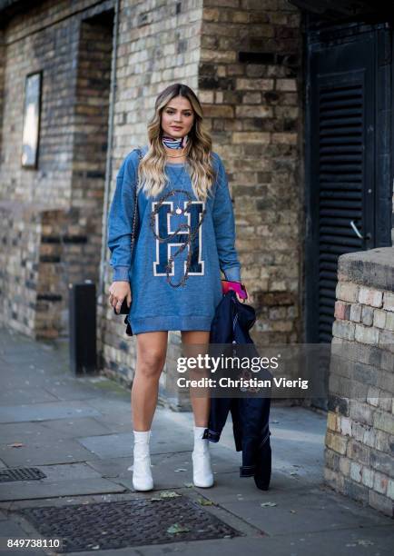 Thassia Naves wearing sweater dress outside Tommy Hilfiger during London Fashion Week September 2017 on September 19, 2017 in London, England.