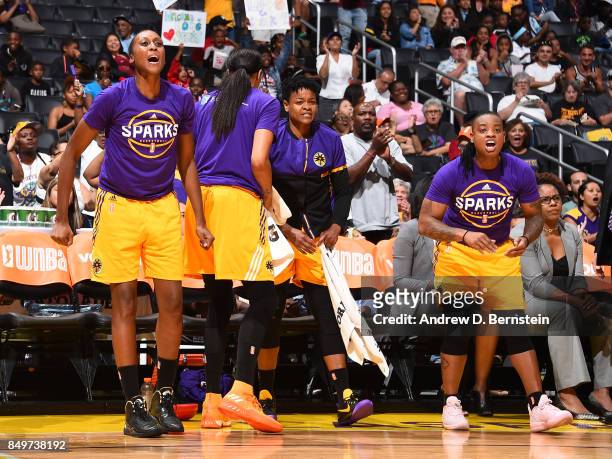 Sandrine Gruda, Alana Beard and Riquna Williams of the Los Angeles Sparks react to a play during the game against the Phoenix Mercury in Game One of...