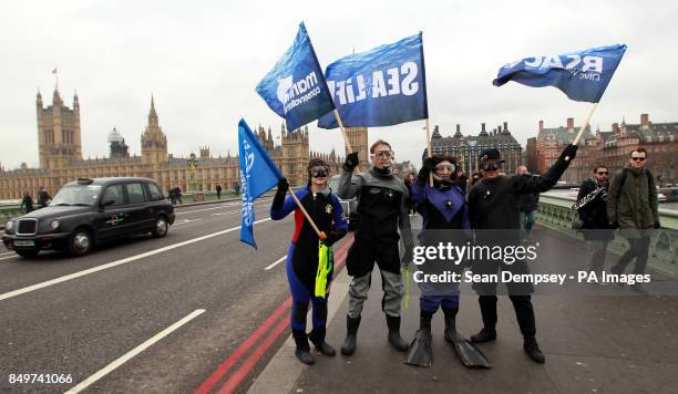 Frogmen on Westminster Bridge in central London as the Marine Conservation Society joins forces with BSAC to call for a commitment by Government to...