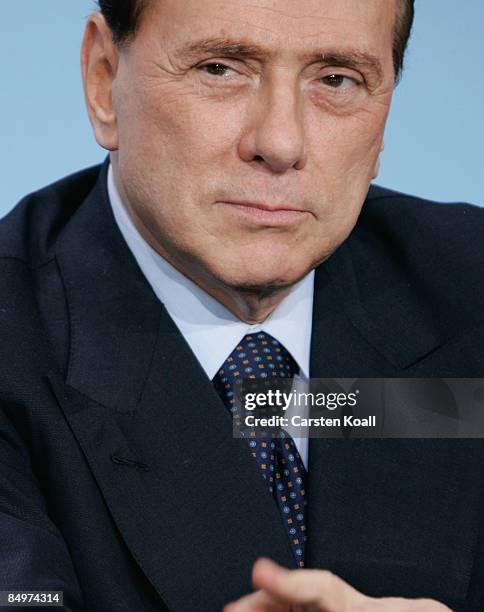 Italian Prime Minister Silvio Berlusconi attends a press conference following a meeting of European Union leaders at the Chancellery on February 22,...