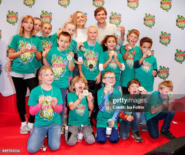 Model Alena Gerber and her boyfriend former German soccer player Clemens Fritz with the children winner team during the KinderTag to celebrate...