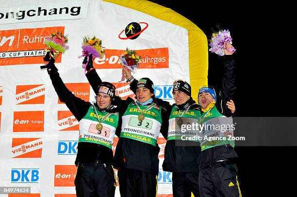 Michael Roesch, Christoph Stephan, Arnd Peiffer and Michael Greis of Germany take third place during the IBU Biathlon World Championships Men's Relay...