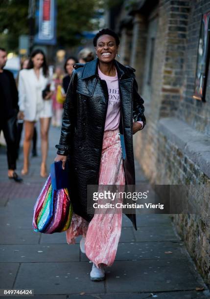 Donna Wallace wearing black coat, flared pants outside Tommy Hilfiger during London Fashion Week September 2017 on September 19, 2017 in London,...