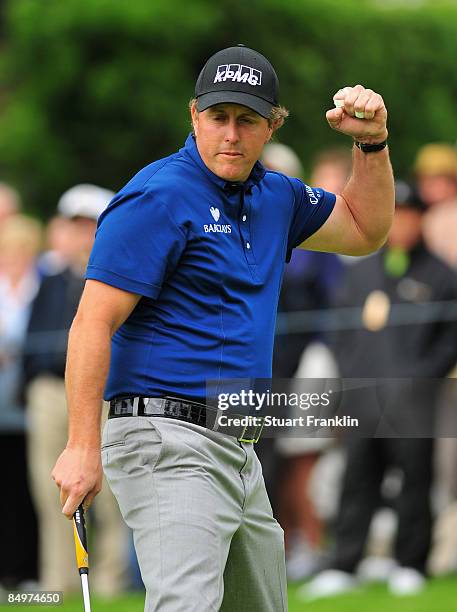 Phil Mickelson of USA celebrates his eagle putt on the first hole during the final round of the Northern Trust Open at the Riviera Country Club...