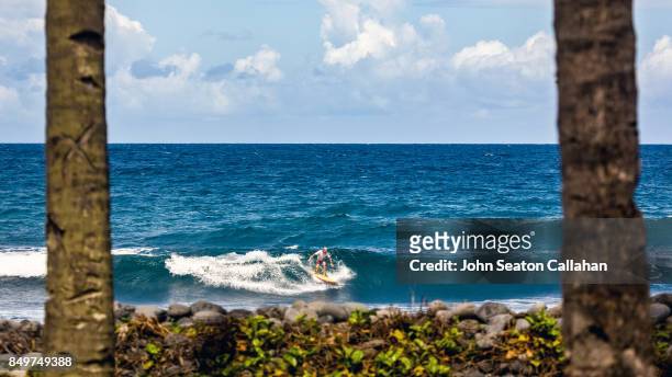 surfing in anjouan island - anjouan island stock pictures, royalty-free photos & images