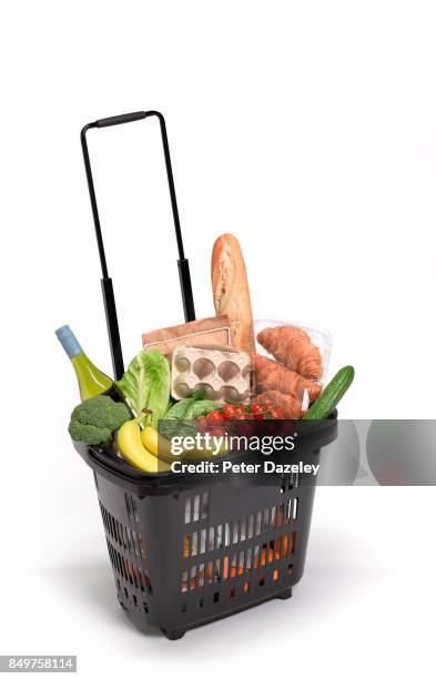shopping basket with food on white background - plein photos et images de collection