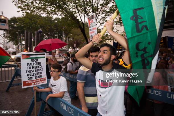 Activists demonstrate in Dag Hammarskjold Plaza across from the United Nations on September 19, 2017 in New York City. President Donald Trump is in...