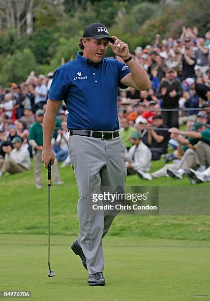 Phil Mickelson reacts after sinking a par putt on the 18th green to win the Northern Trust Open held at Riviera Country Club on February 22, 2009 in...