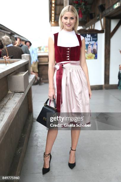 Lena Gercke, wearing a red dirndl by 'Amsel Fashion' during the "BMW Wies'n Sport-Stammtisch" as part of the Oktoberfest at Theresienwiese on...